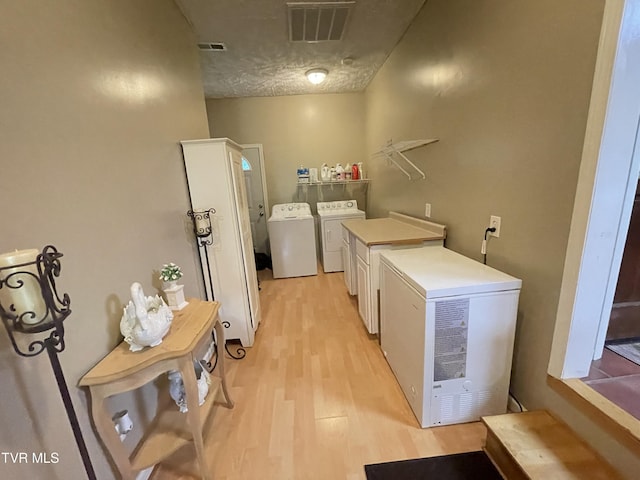 134 Carver Crabtree Rd, Hampton, TN 37658 - laundry room featuring washer and dryer and light wood finished floors