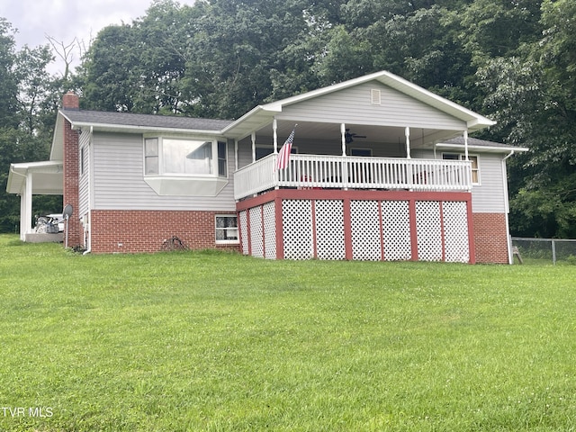 134 Carver Crabtree Rd, Hampton, TN 37658 - view of front of home featuring a chimney, a front yard, and brick siding