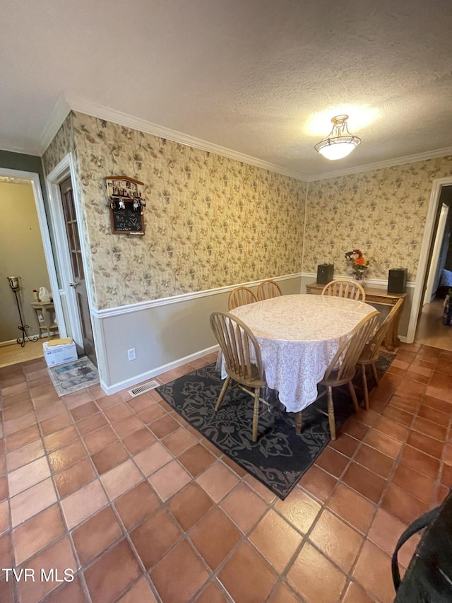 134 Carver Crabtree Rd, Hampton, TN 37658 - dining room featuring crown molding, wainscoting, wallpapered walls, a textured ceiling, and tile patterned flooring