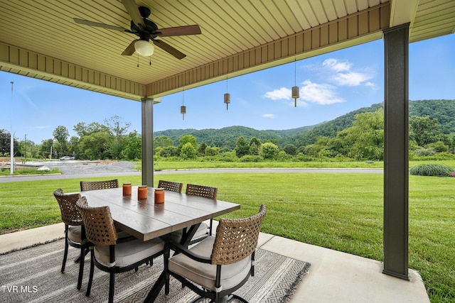 107 Ervin Loop, Erwin, TN 37650 - view of patio with ceiling fan, outdoor dining area, and a view of trees
