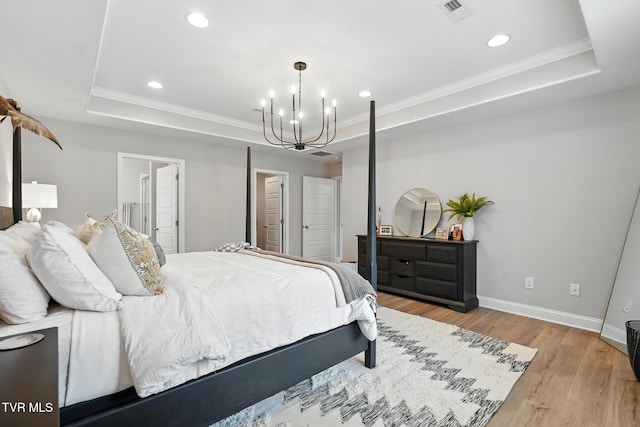 107 Ervin Loop, Erwin, TN 37650 - bedroom with a tray ceiling, a chandelier, light wood finished floors, recessed lighting, and crown molding