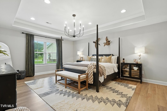 107 Ervin Loop, Erwin, TN 37650 - bedroom with a tray ceiling, a chandelier, ornamental molding, light wood-type flooring, and recessed lighting