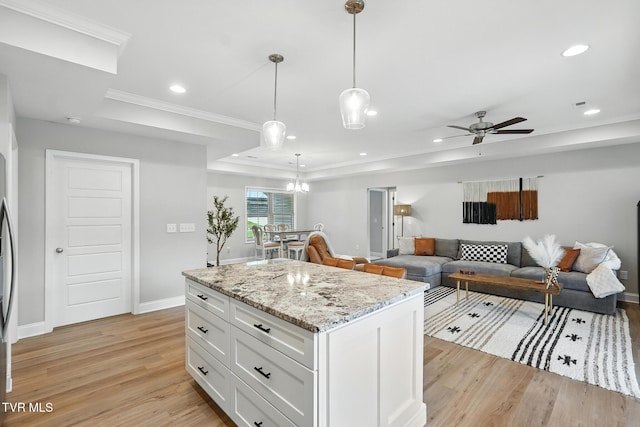107 Ervin Loop, Erwin, TN 37650 - kitchen featuring light wood finished floors, a raised ceiling, white cabinets, crown molding, and ceiling fan