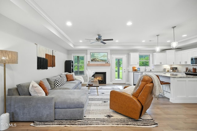 107 Ervin Loop, Erwin, TN 37650 - living room with healthy amount of natural light, light wood finished floors, a ceiling fan, recessed lighting, and a glass covered fireplace
