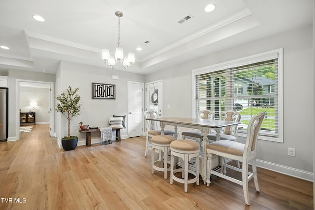 107 Ervin Loop, Erwin, TN 37650 - dining area with a raised ceiling, ornamental molding, recessed lighting, light wood-type flooring, and a chandelier