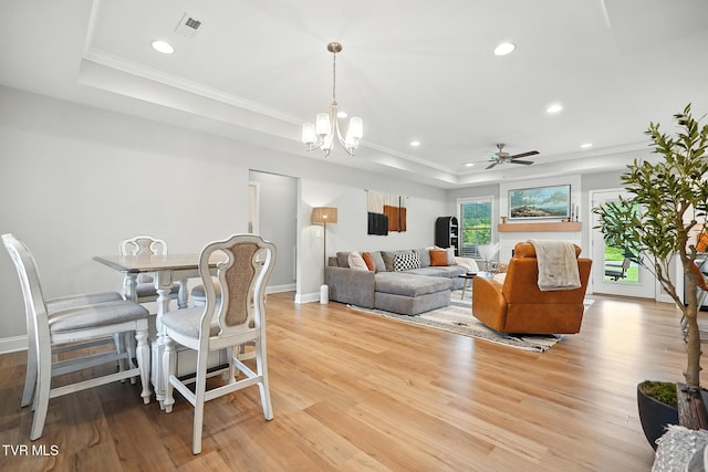 107 Ervin Loop, Erwin, TN 37650 - living room with a tray ceiling, light wood finished floors, ornamental molding, recessed lighting, and a chandelier
