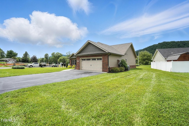 107 Ervin Loop, Erwin, TN 37650 - view of side of property featuring brick siding, driveway, and a garage