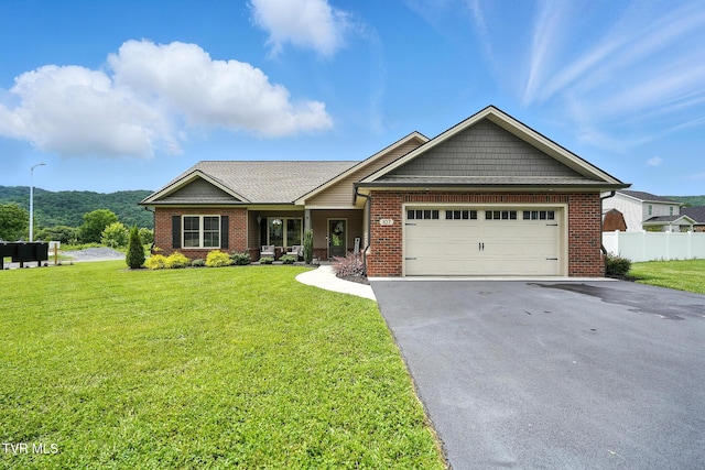 107 Ervin Loop, Erwin, TN 37650 - view of front facade with driveway, brick siding, and an attached garage