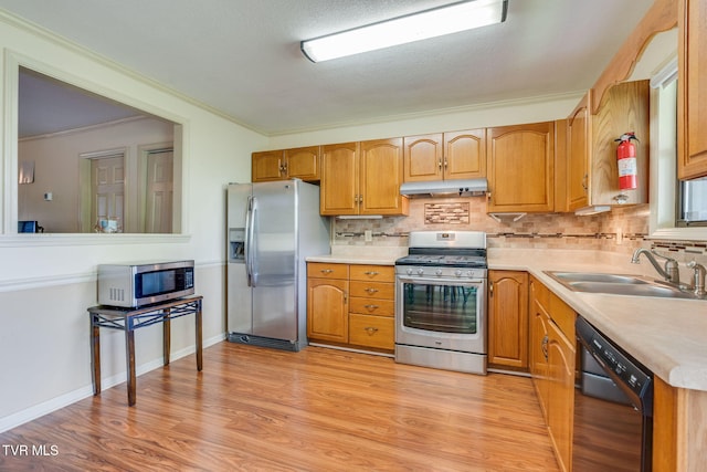 151 Woodcrest Ln Unit 0, Bristol, VA 24201 - kitchen featuring appliances with stainless steel finishes, under cabinet range hood, ornamental molding, backsplash, and light countertops