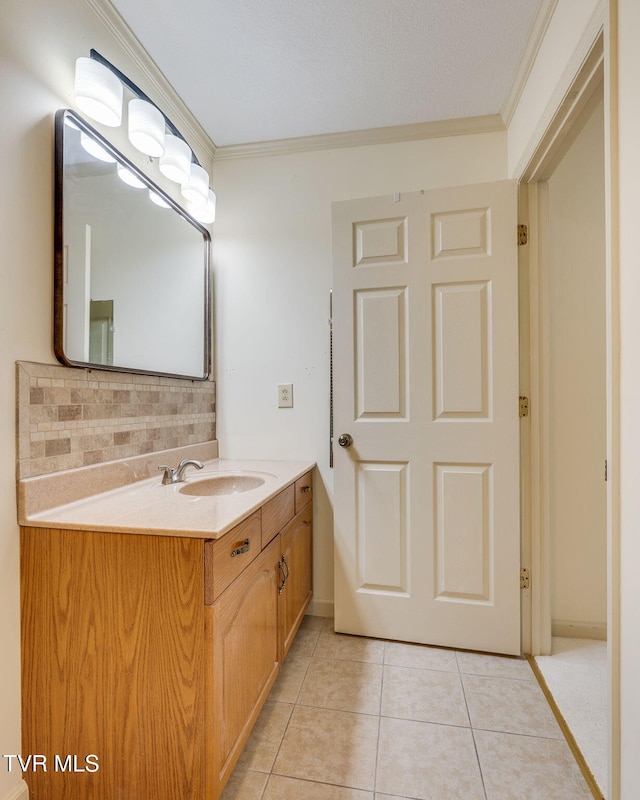 151 Woodcrest Ln Unit 0, Bristol, VA 24201 - bathroom with crown molding, vanity, backsplash, and tile patterned flooring