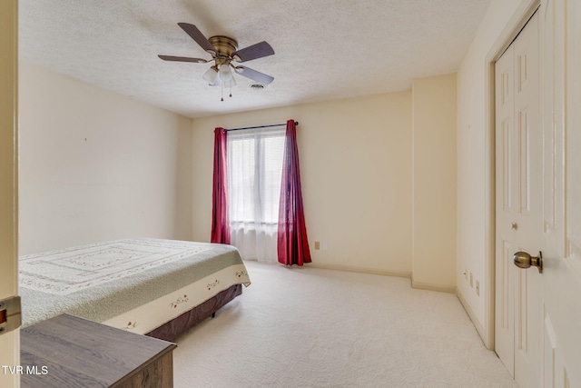 151 Woodcrest Ln Unit 0, Bristol, VA 24201 - carpeted bedroom featuring a textured ceiling, ceiling fan, and a closet