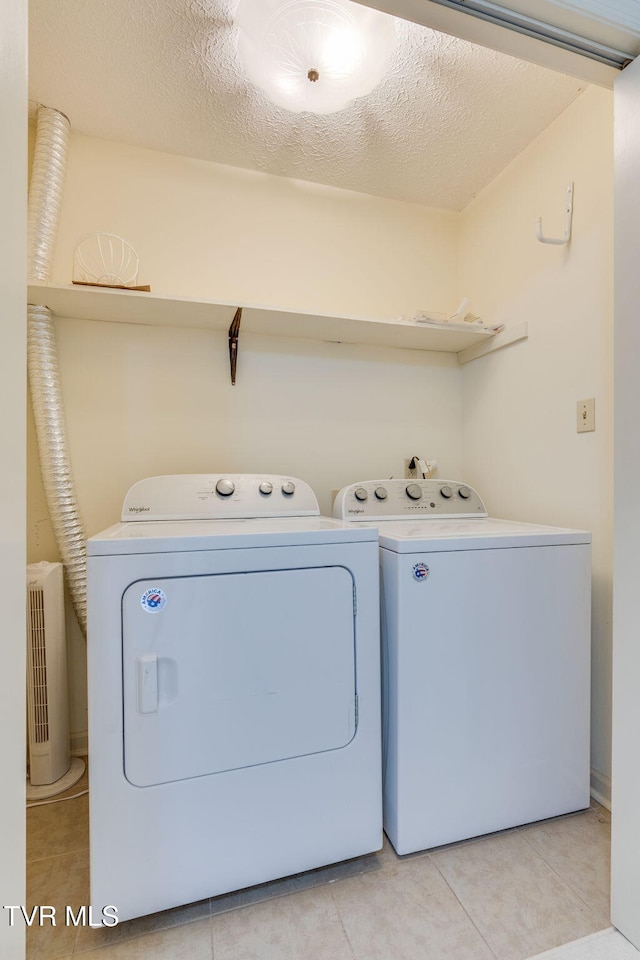 151 Woodcrest Ln Unit 0, Bristol, VA 24201 - laundry room featuring washer and dryer and light tile patterned floors
