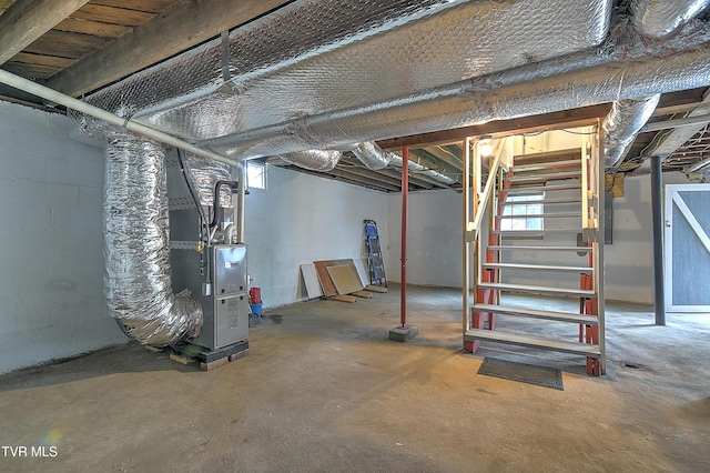 1648 E St, Kingsport, TN 37664 - below grade area featuring stairway, heating unit, and electric panel