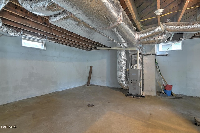 1648 E St, Kingsport, TN 37664 - below grade area featuring heating unit and healthy amount of natural light