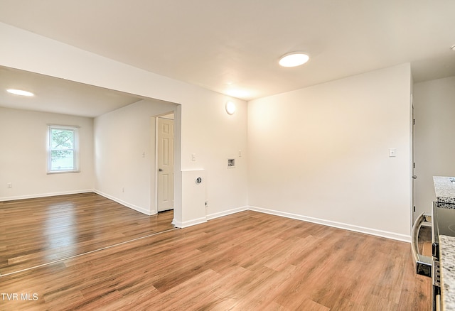 1648 E St, Kingsport, TN 37664 - spare room with light wood-type flooring and baseboards