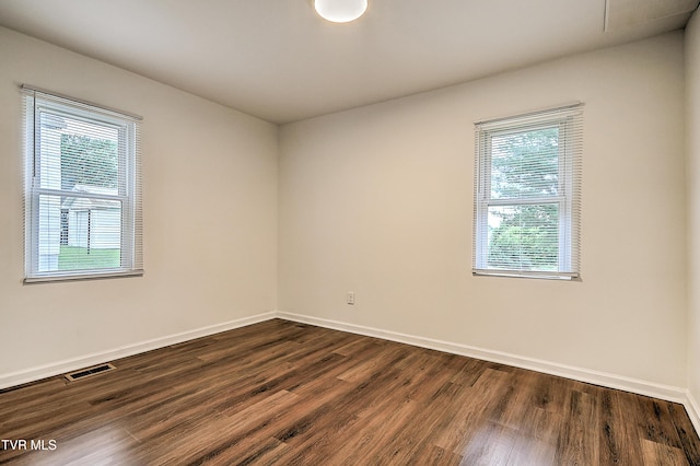 1648 E St, Kingsport, TN 37664 - unfurnished room featuring healthy amount of natural light and dark wood finished floors