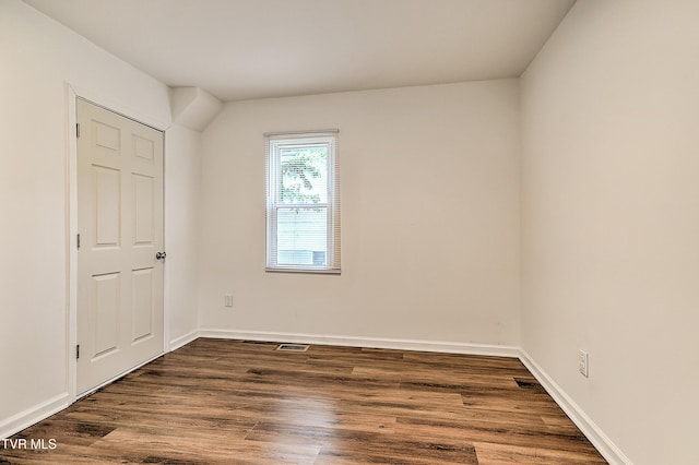 1648 E St, Kingsport, TN 37664 - unfurnished bedroom with dark wood-style flooring and baseboards