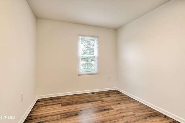 1648 E St, Kingsport, TN 37664 - unfurnished room featuring wood finished floors and baseboards