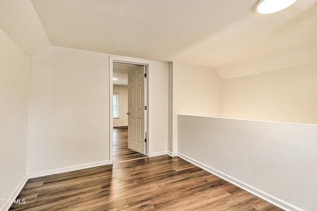 1648 E St, Kingsport, TN 37664 - spare room with lofted ceiling and wood finished floors