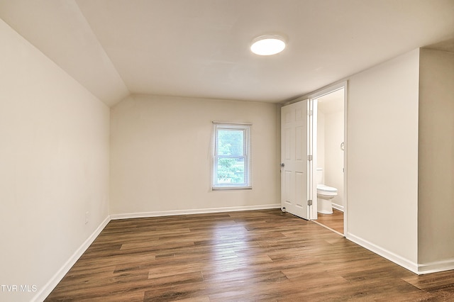 1648 E St, Kingsport, TN 37664 - unfurnished bedroom with dark wood-style flooring and ensuite bathroom