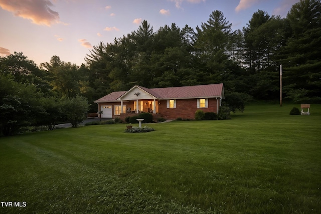 1037 Swift Hollow Rd, Mountain City, TN 37683 - ranch-style house featuring a garage, a lawn, covered porch, and a metal roof