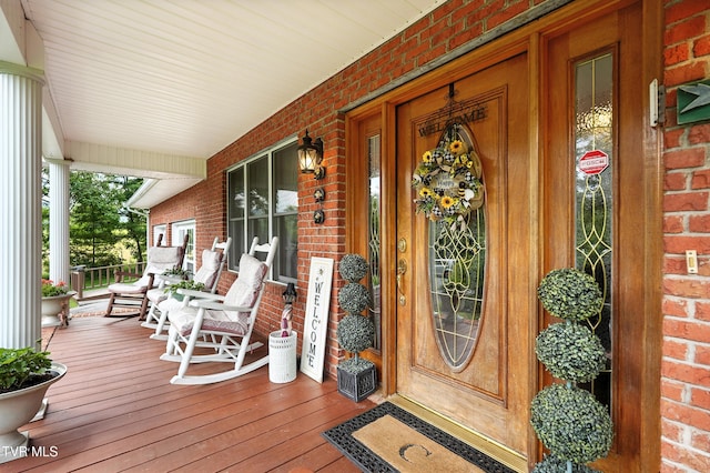 1037 Swift Hollow Rd, Mountain City, TN 37683 - view of exterior entry with covered porch and brick siding