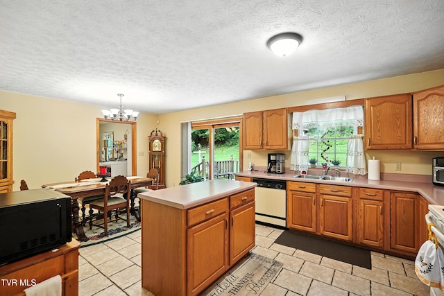 1037 Swift Hollow Rd, Mountain City, TN 37683 - kitchen featuring dishwasher, light countertops, a chandelier, a kitchen island, and a textured ceiling