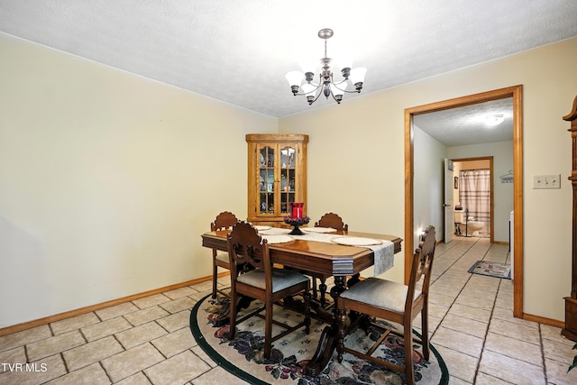 1037 Swift Hollow Rd, Mountain City, TN 37683 - dining space with a chandelier, light tile patterned floors, and a textured ceiling
