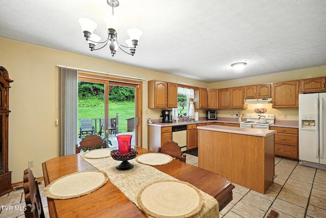 1037 Swift Hollow Rd, Mountain City, TN 37683 - kitchen featuring white appliances, light countertops, under cabinet range hood, a kitchen island, and a chandelier