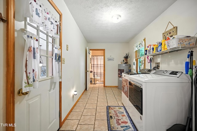 1037 Swift Hollow Rd, Mountain City, TN 37683 - washroom with washing machine and clothes dryer, a textured ceiling, and water heater