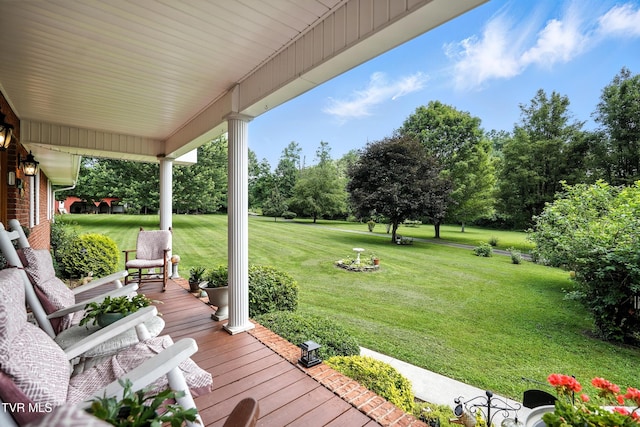 1037 Swift Hollow Rd, Mountain City, TN 37683 - porch featuring a lawn and view of wooded area