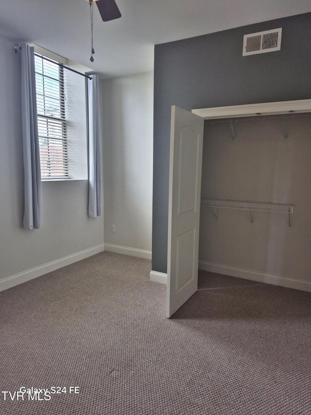 116 Tipton St Unit 209, Johnson City, TN 37604 - unfurnished bedroom with carpet, a closet, and a ceiling fan