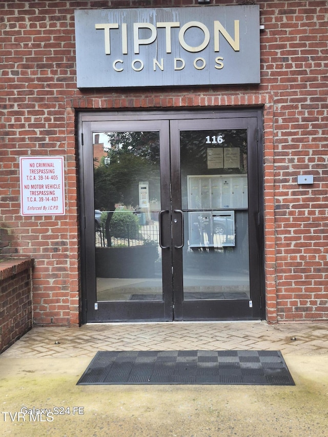 116 Tipton St Unit 209, Johnson City, TN 37604 - doorway to property with brick siding and french doors