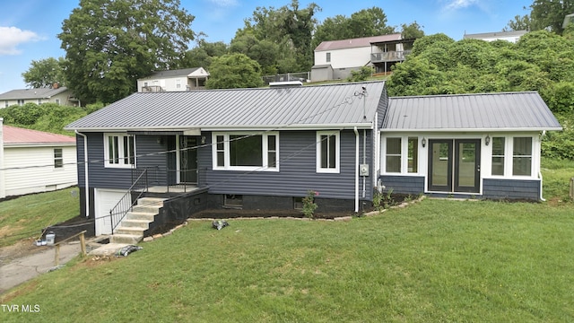 3974 Memorial Blvd, Kingsport, TN 37664 - colonial inspired home with a front yard, a garage, and a metal roof