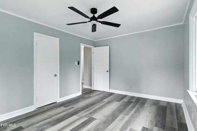 3974 Memorial Blvd, Kingsport, TN 37664 - unfurnished bedroom with wood finished floors, crown molding, and ceiling fan