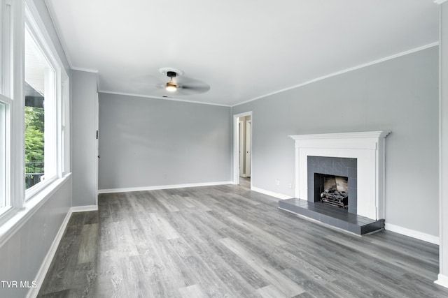 3974 Memorial Blvd, Kingsport, TN 37664 - unfurnished living room featuring a ceiling fan, wood finished floors, a tiled fireplace, and ornamental molding