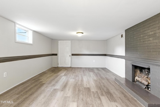 3974 Memorial Blvd, Kingsport, TN 37664 - basement with light wood-style flooring and a fireplace