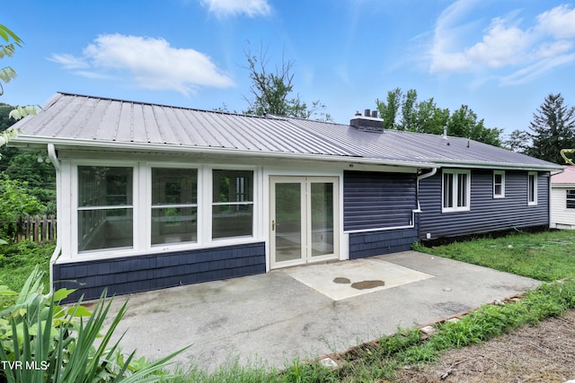 3974 Memorial Blvd, Kingsport, TN 37664 - back of property with a patio, a chimney, and a metal roof