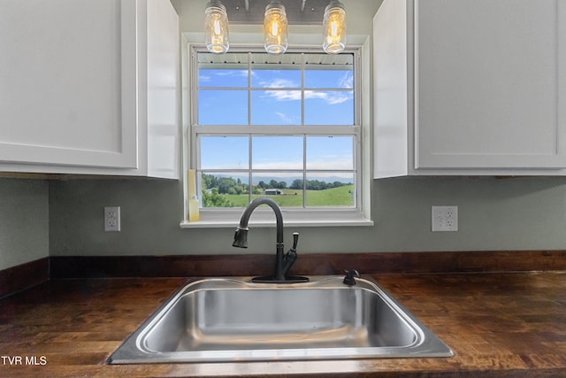 3500 Old Stage Rd, Chuckey, TN 37641 - kitchen with white cabinetry and pendant lighting