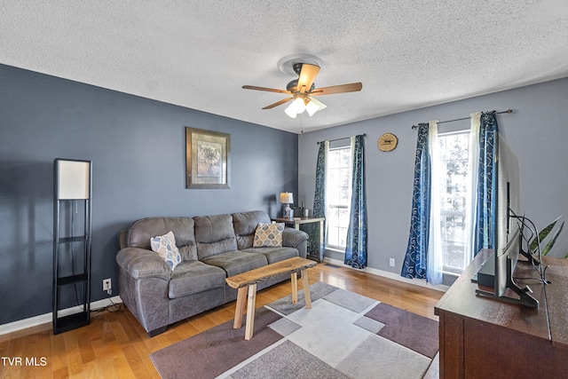 3500 Old Stage Rd, Chuckey, TN 37641 - living area featuring a ceiling fan, wood finished floors, and a textured ceiling