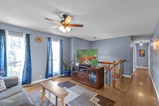 3500 Old Stage Rd, Chuckey, TN 37641 - living room with ceiling fan, wood finished floors, and a textured ceiling