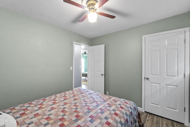 3500 Old Stage Rd, Chuckey, TN 37641 - bedroom featuring dark wood finished floors, a textured ceiling, and a ceiling fan