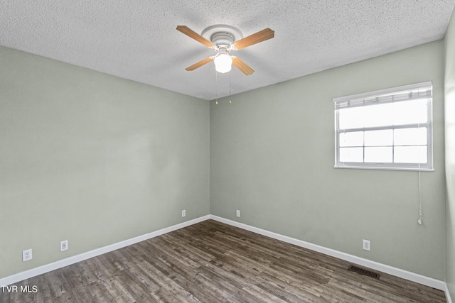 3500 Old Stage Rd, Chuckey, TN 37641 - unfurnished room with dark wood-style floors, a ceiling fan, and a textured ceiling