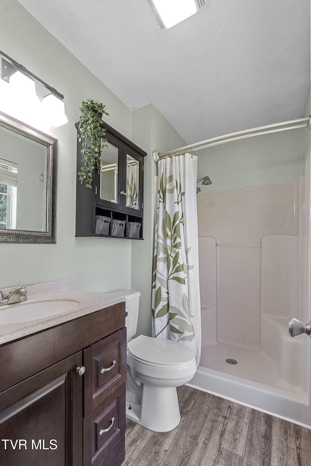 3500 Old Stage Rd, Chuckey, TN 37641 - full bathroom with wood finished floors, vanity, and a shower with curtain
