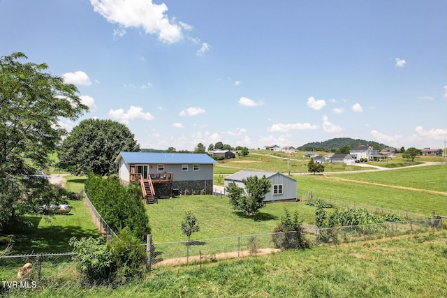 3500 Old Stage Rd, Chuckey, TN 37641 - fenced backyard with stairway, a wooden deck, and an outdoor structure