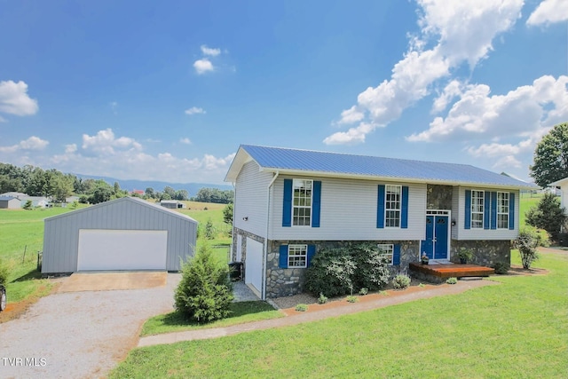 3500 Old Stage Rd, Chuckey, TN 37641 - bi-level home with a detached garage, stone siding, a front yard, a metal roof, and an outdoor structure