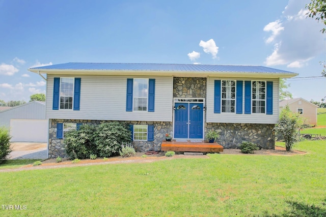 3500 Old Stage Rd, Chuckey, TN 37641 - split foyer home with stone siding, a front yard, an outbuilding, and a metal roof