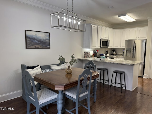 700 NW The Terrace St Unit D, Norton, VA 24273 - dining space featuring dark wood finished floors and ornamental molding
