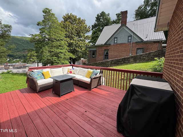 700 NW The Terrace St Unit D, Norton, VA 24273 - wooden terrace with area for grilling, an outdoor living space, and a yard