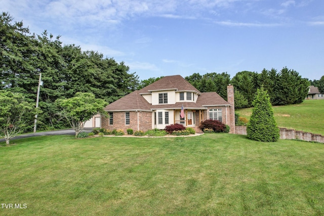 945 Dashaway Rd, Chuckey, TN 37641 - traditional-style house featuring a chimney, a front yard, an outbuilding, and brick siding